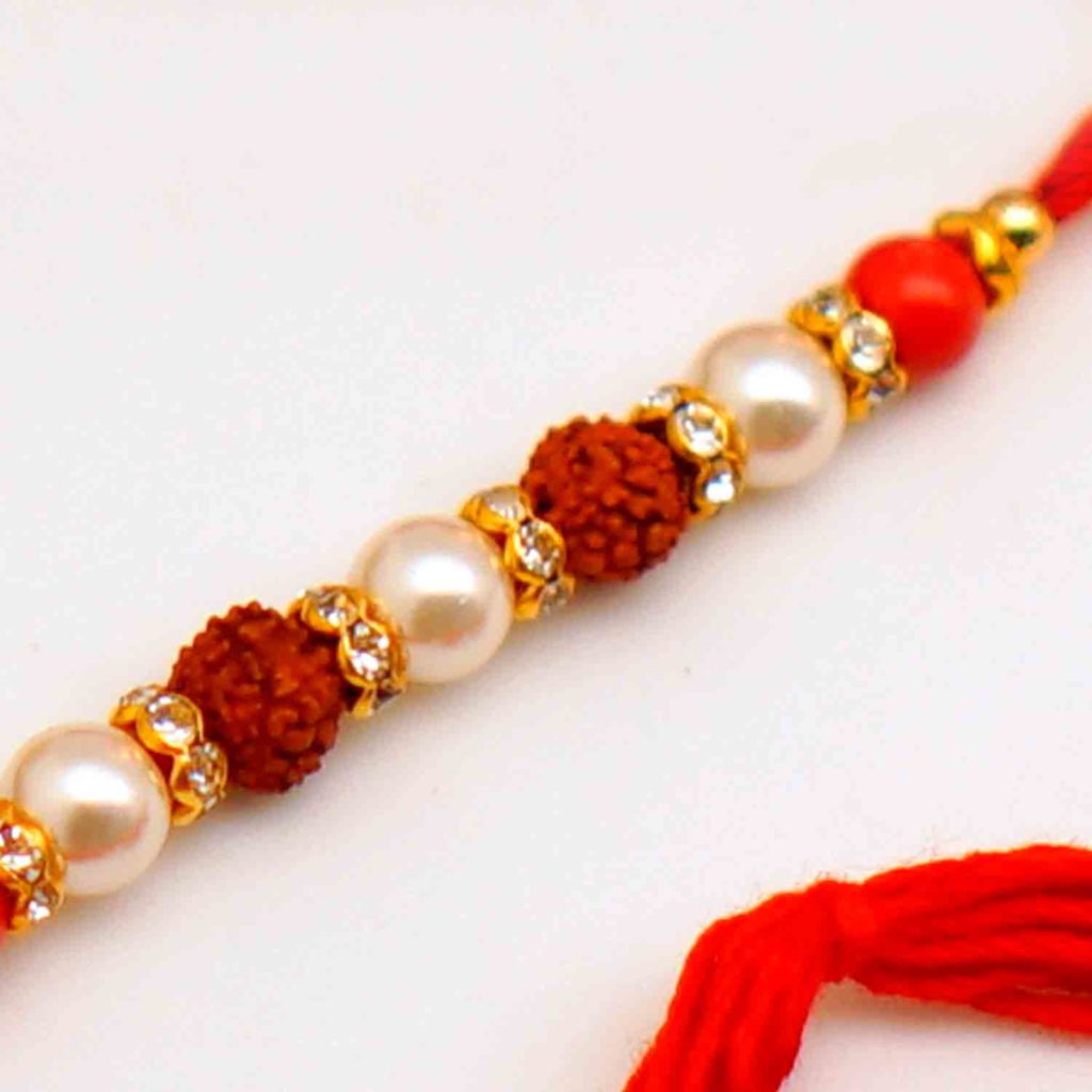 Home / Traditional Rakhi / Traditional Rakhi - USA / Paired rudraksh Rakhi