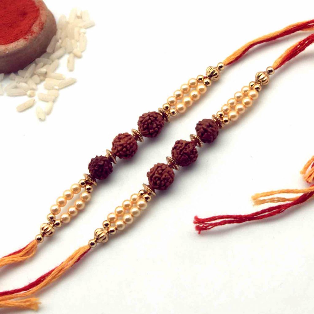 3 Rudraksha Seeds Rakhi With Small Golden Beads – Pack of 2 $ 13.95