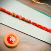 Red Traditional Pearl Rakhi - Image 3