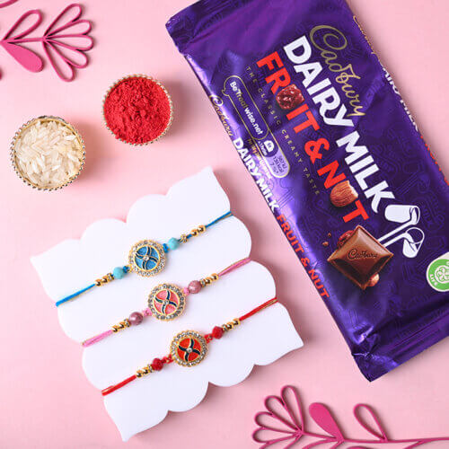 Designer Rakhi Trio With Dairy Milk Fruit & Nut Chocolate Bar