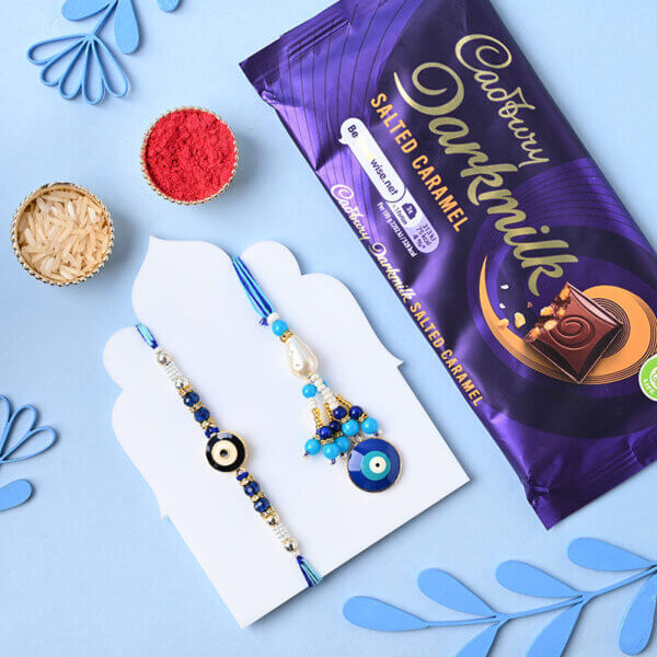 Evil Eye Couple Rakhi With Cadbury Dark Milk Caramel Bar