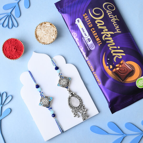 Intricate Couple Rakhi With Cadbury Dark Milk Caramel Bar